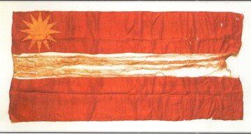 The first known red-white-red flag, sewn by Marianna Straumane. A sun is sewn on its base. After restoration, it can be viewed in the exhibition of the Cēsis History and Art Museum. Source: Valmiera Museum
