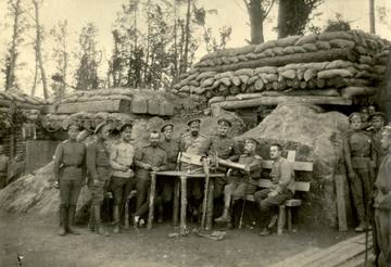 Latvian riflemen on Death Island near a machine gun seized from German soldiers. 1916. Latvian War Museum