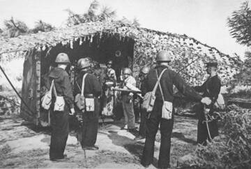 B-13 gun. Gun crew during firing exercises.
